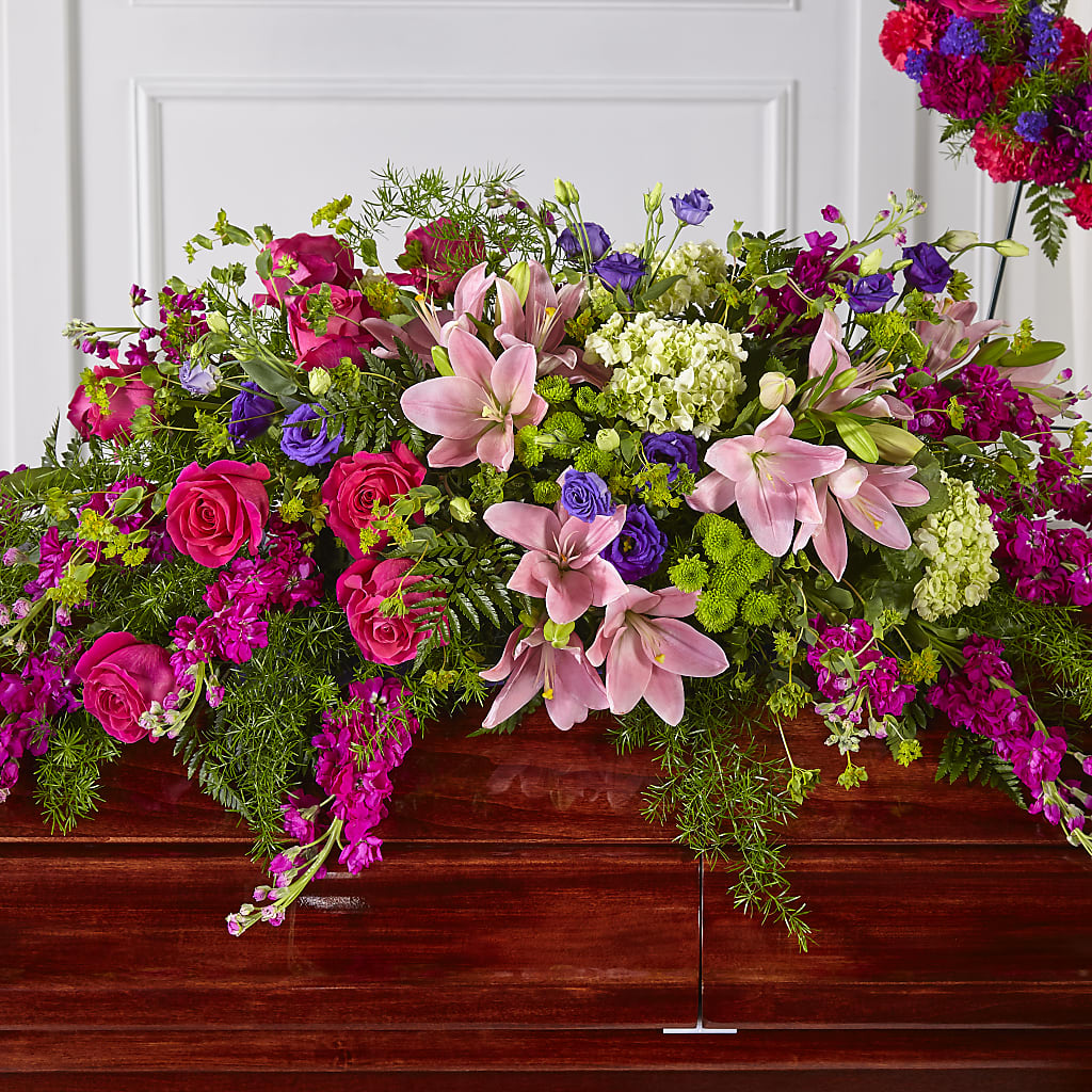 Radiant Tribute Casket Spray – 175 MERCANTILE FLORAL & GIFT, Lake City IA
